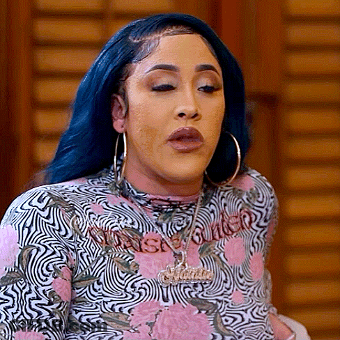 Woman With Blue Hair, Hoop Earrings, Pink Black Floral Shirt GIF