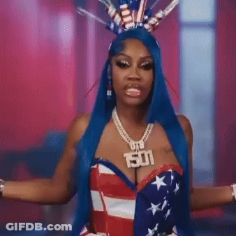 Woman With Blue Hair In American Flag Costume And 501 Necklace GIF