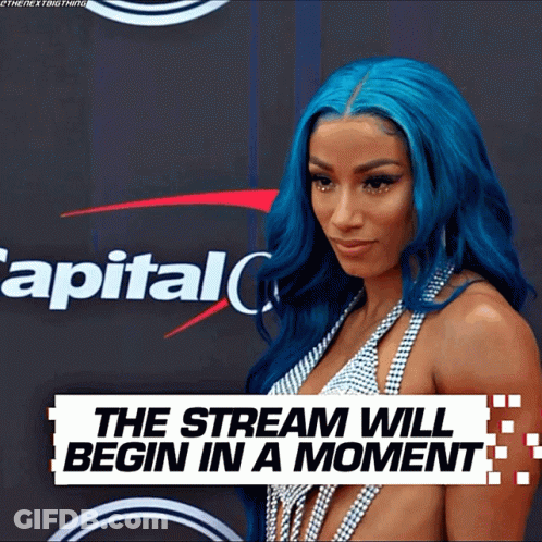 Woman With Blue Hair In Front Of Capital One Sign GIF