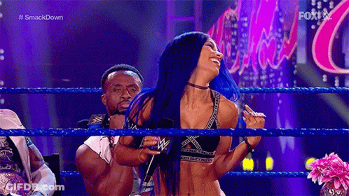 Woman With Blue Hair In Wrestling Ring Next To Man GIF