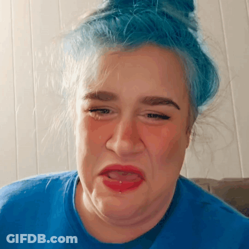 Woman With Blue Hair Making Funny Face GIF