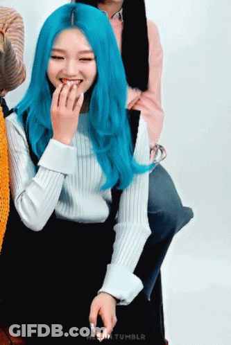 Woman With Blue Hair Smiling Hand To Mouth GIF