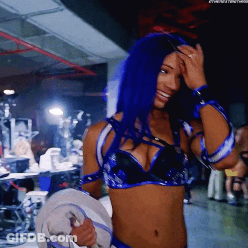 Woman With Blue Hair Smiling Holding Towel GIF