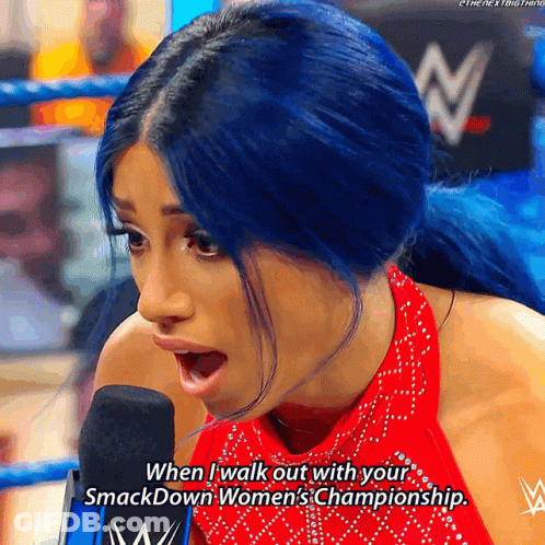 Woman With Blue Hair Talks Into Microphone Saying When I Walk Out With Your Smackdown Women's GIF
