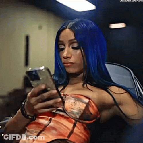Woman With Blue Hair Using Cell Phone GIF