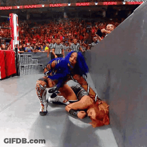 Woman With Blue Hair Wrestling Another Woman In Crowd GIF
