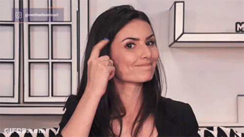 Woman With Blue Nail Polish Smiling And Pointing At Hair GIF