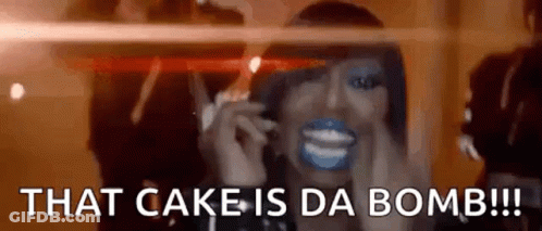 Woman With Blue Paint On Face Talking On Cell Phone That Cake Is Da Bomb GIF