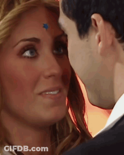Woman With Blue Star On Forehead Kisses Man GIF