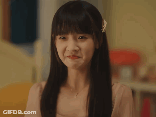 Woman With Bow In Hair Looking GIF