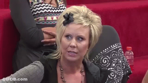 Woman With Bow Sitting On Couch GIF