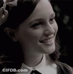 Woman With Bow Smiling GIF
