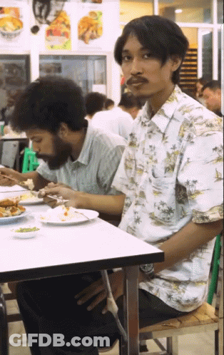 Woman With Braces Making Heart Shape GIF