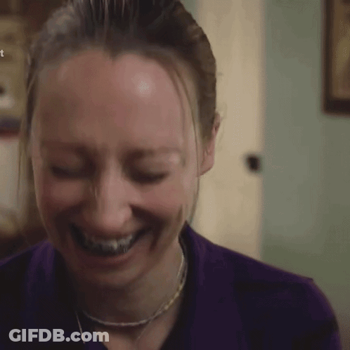 Woman With Braces Smiling In Purple Shirt GIF