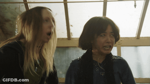 Woman With Braces Smiling In Purple Shirt GIF