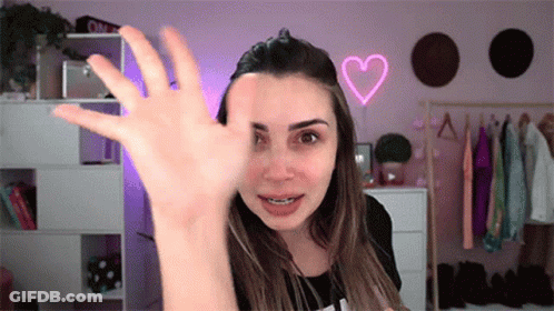 Woman With Braces Waving GIF