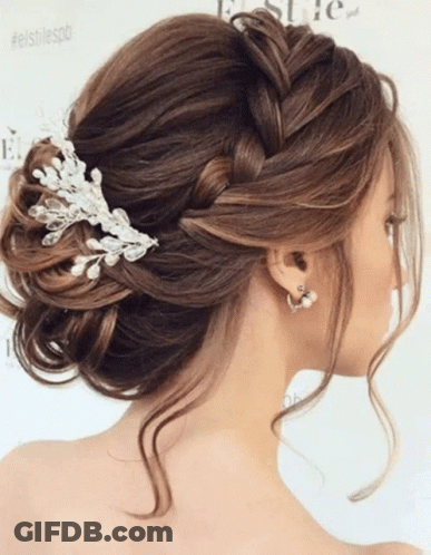 Woman With Braided Bun And Pearl Comb GIF