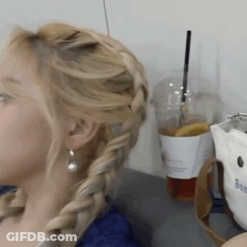 Woman With Braided Hair Next To Coffee GIF