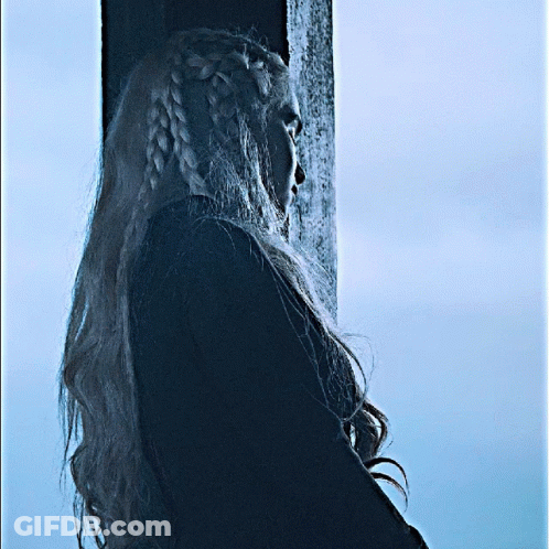 Woman With Braided Hair Standing By Pole GIF