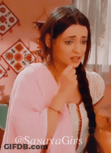 Woman With Braided Hair Standing In Front Of Pink Wall With @Sanayagifs Sign GIF