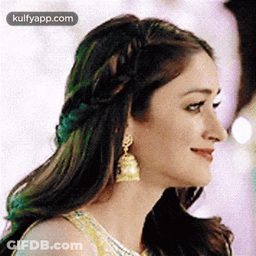 Woman With Braided Headband And Earrings GIF