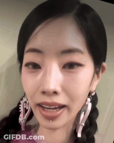 Woman With Braids And Earrings GIF