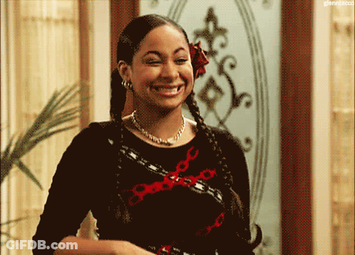 Woman With Braids And Flower In Hair Smiling GIF