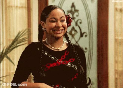 Woman With Braids And Flower Smiling GIF