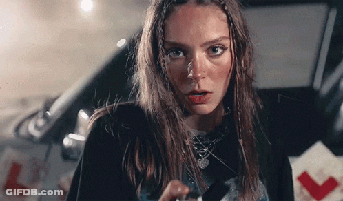 Woman With Braids Holding Knife GIF