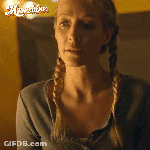 Woman With Braids Saying Its True In Front Of Moonshine Logo GIF