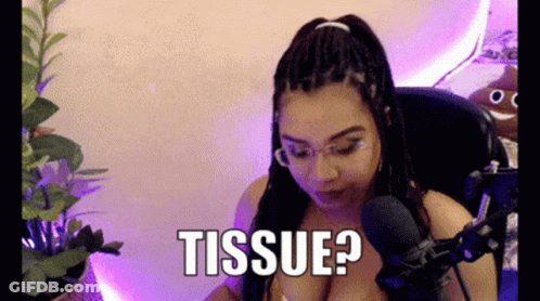 Woman With Braids Sitting At Microphone Saying Tissue GIF