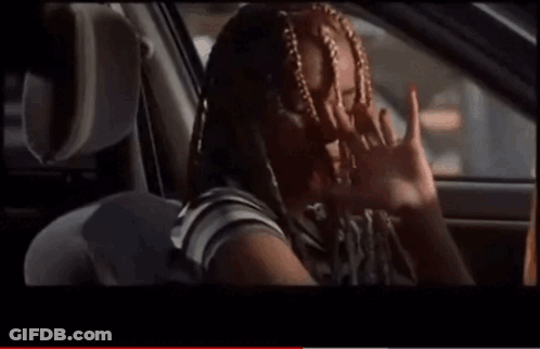 Woman With Braids Smiling In Back Seat Of Car GIF