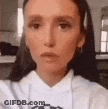Woman With Braids Smiling In Kitchen GIF
