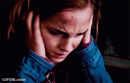 Woman With Bruise On Forehead Covering Ears GIF