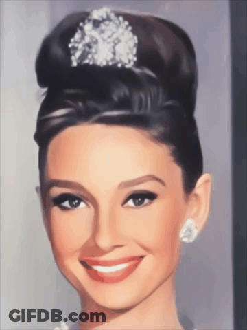 Woman With Bun And Diamond In Hair GIF