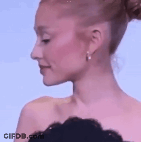 Woman With Bun And Earrings Close Up GIF