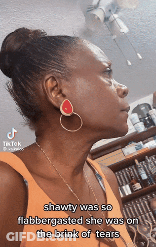 Woman With Bun And Earrings With TikTok Sticker GIF