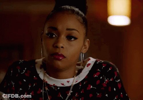 Woman With Bun Earrings And Necklace GIF
