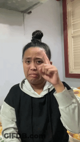 Woman With Bun Making Face GIF