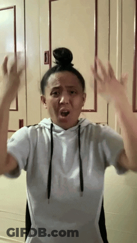 Woman With Bun Making Funny Face GIF