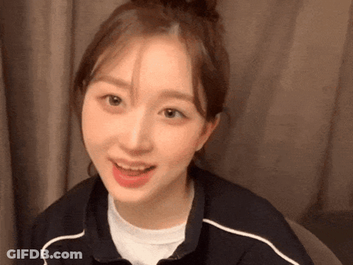 Woman With Bun On Head Close Up GIF