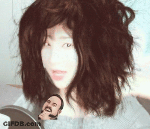 Woman With Cartoon Face On Chest GIF