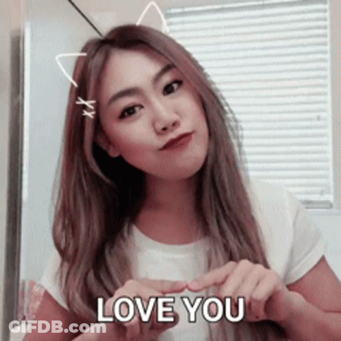 Woman With Cat Ears Making Heart Shape GIF
