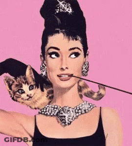 Woman With Cat On Shoulder And Necklace GIF