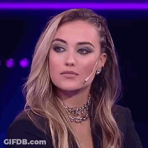 Woman With Choker And Earrings Looking At Camera GIF