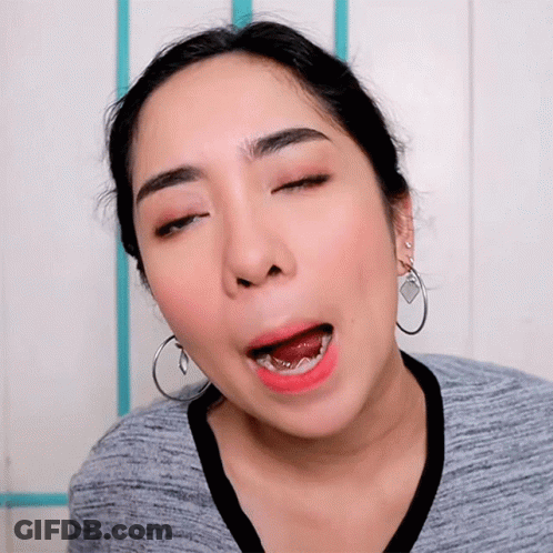 Woman With Closed Eyes And Hoop Earrings GIF