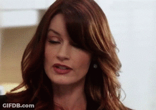 Woman With Closed Eyes And Red Hair GIF