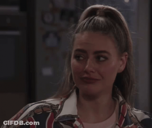 Woman With Closed Eyes In NY Jacket GIF