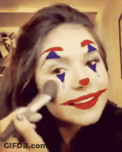Woman With Clown Face Paint Applying Makeup GIF