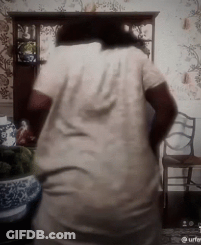 Woman With Cross Necklace Making Funny Face GIF